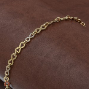 Gold-tone Silver Bracelet with Engraved Infinity Design and Geometric Zircon Stones Gold-tone Silver Bracelet with Engraved Infinity Design and Geometric Zircon Stones